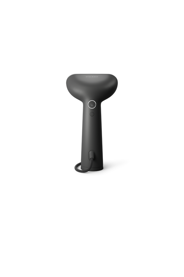 Charcoal handheld steamer on a white background