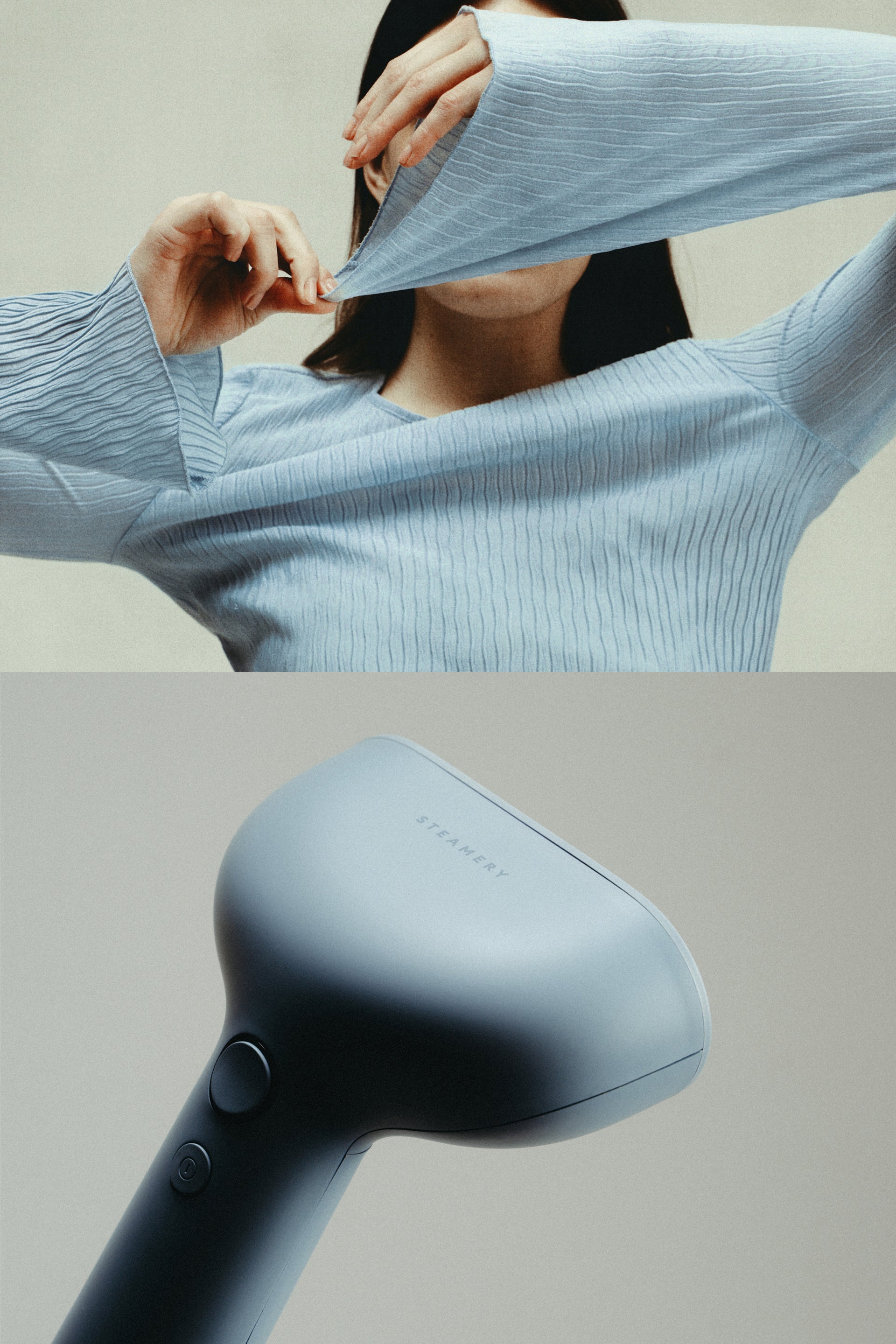 Person wearing a light blue sweater with a close-up of a blue garment steamer
