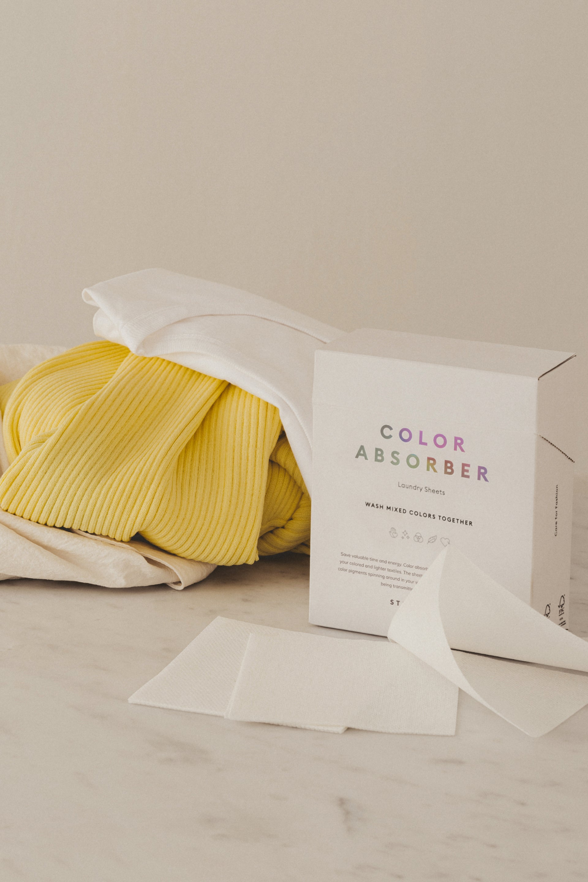 Yellow fabric with a box labeled 'Color Absorber' on a light surface.