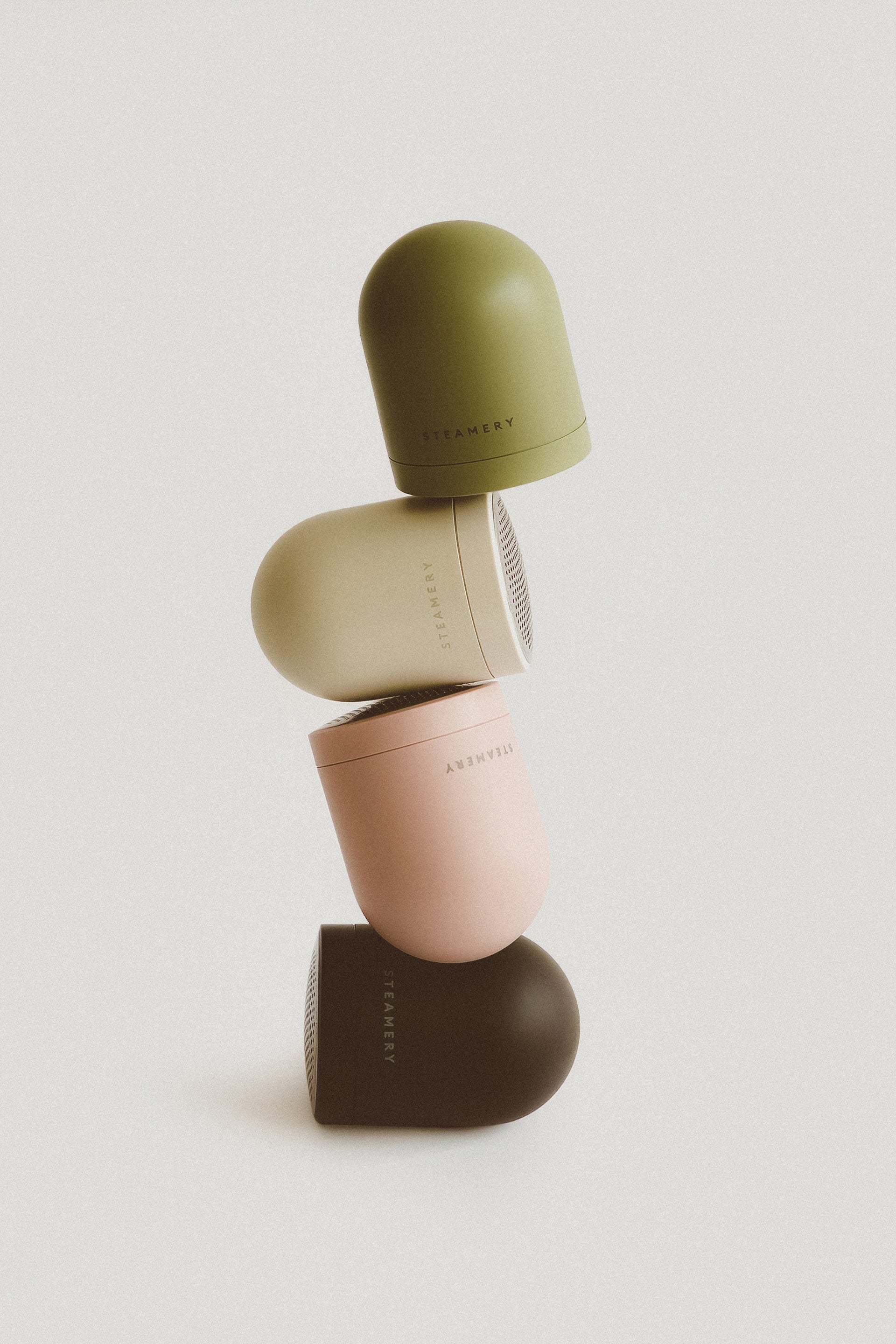 Stack of four pilo 2 fabric shavers with on a light gray background