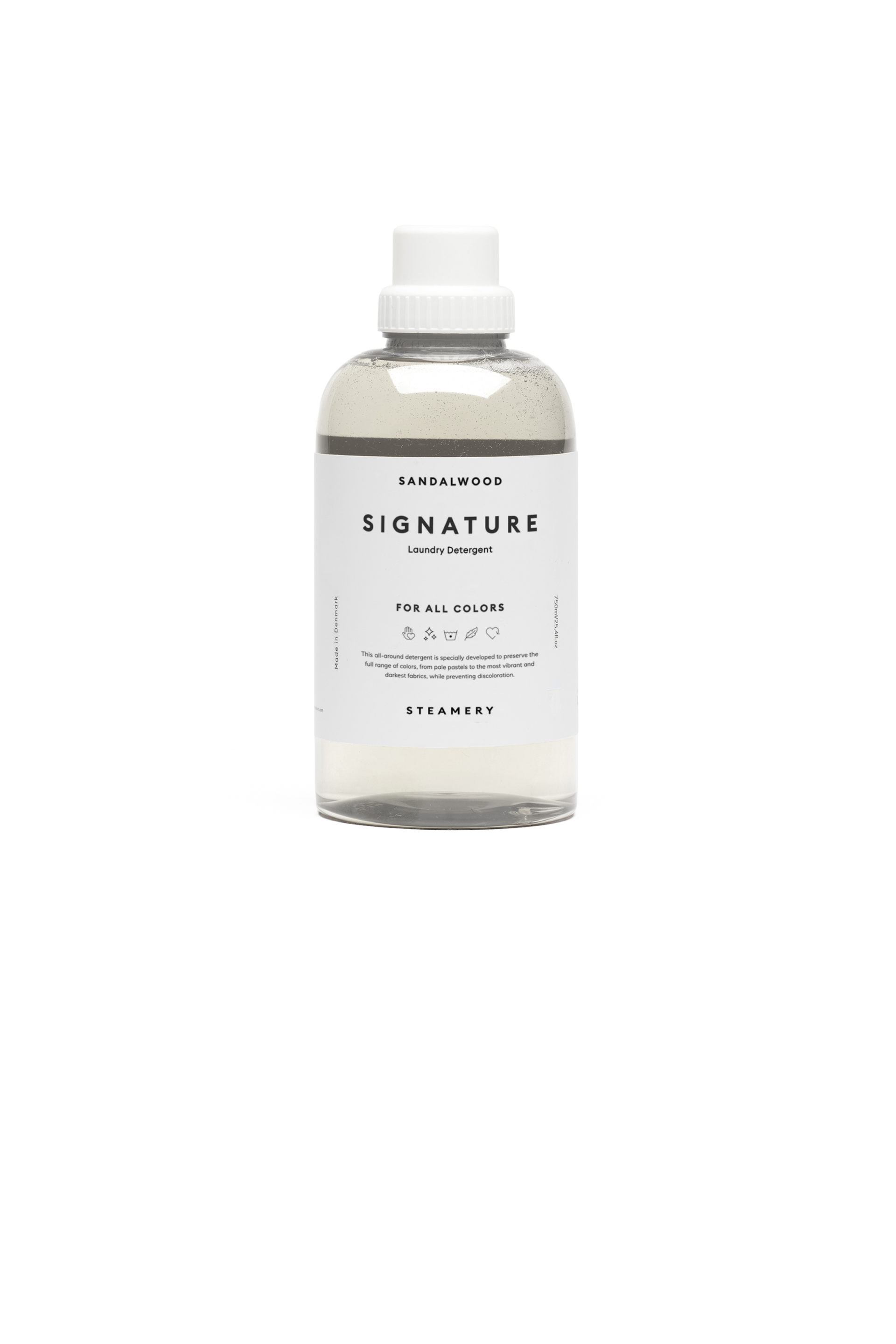 Bottle of signature laundry detergent on a white background
