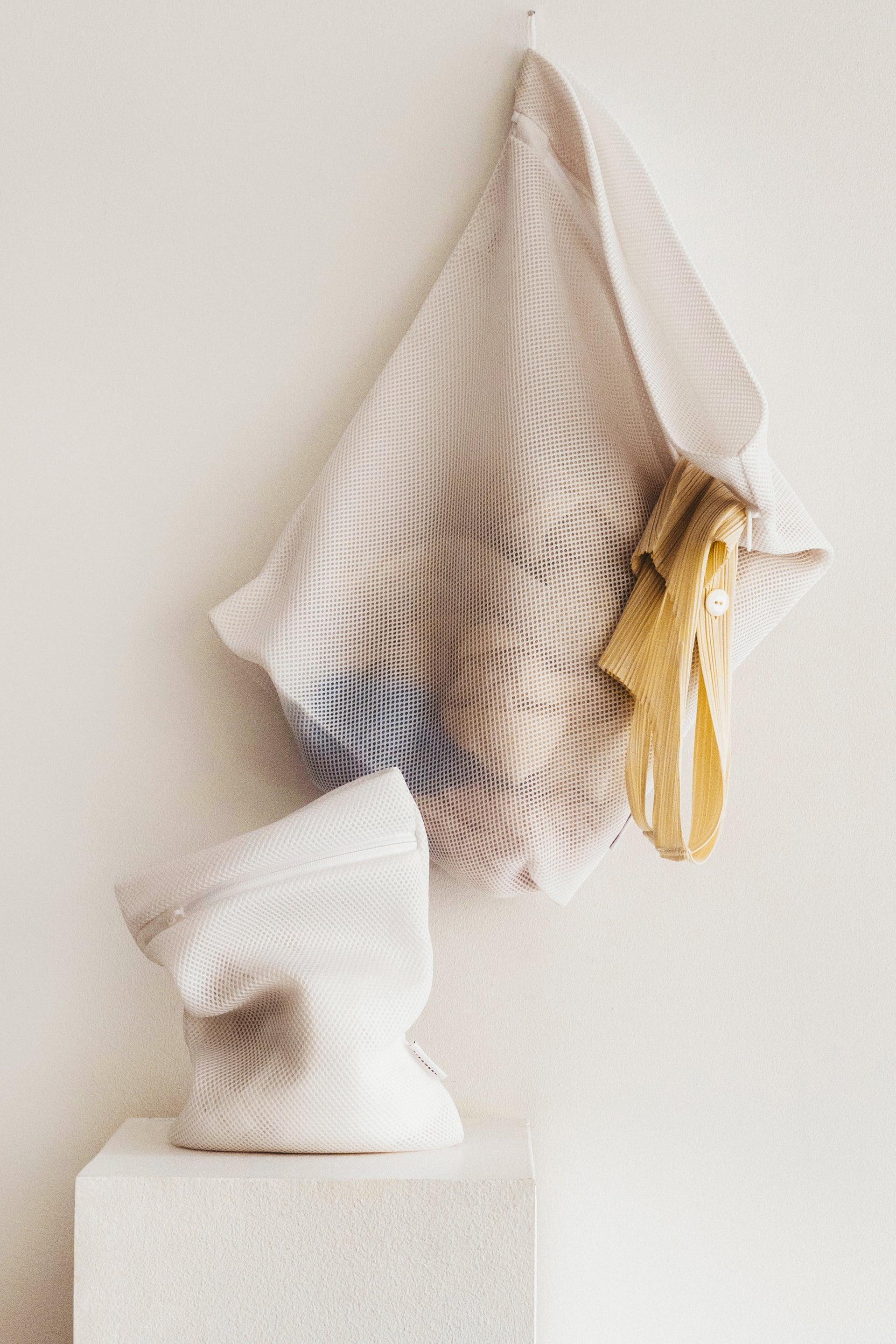 White washing bag hanging on a wall