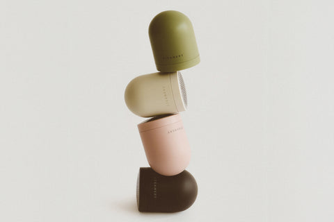 Stack of four pilo 2 fabric shavers with on a light gray background