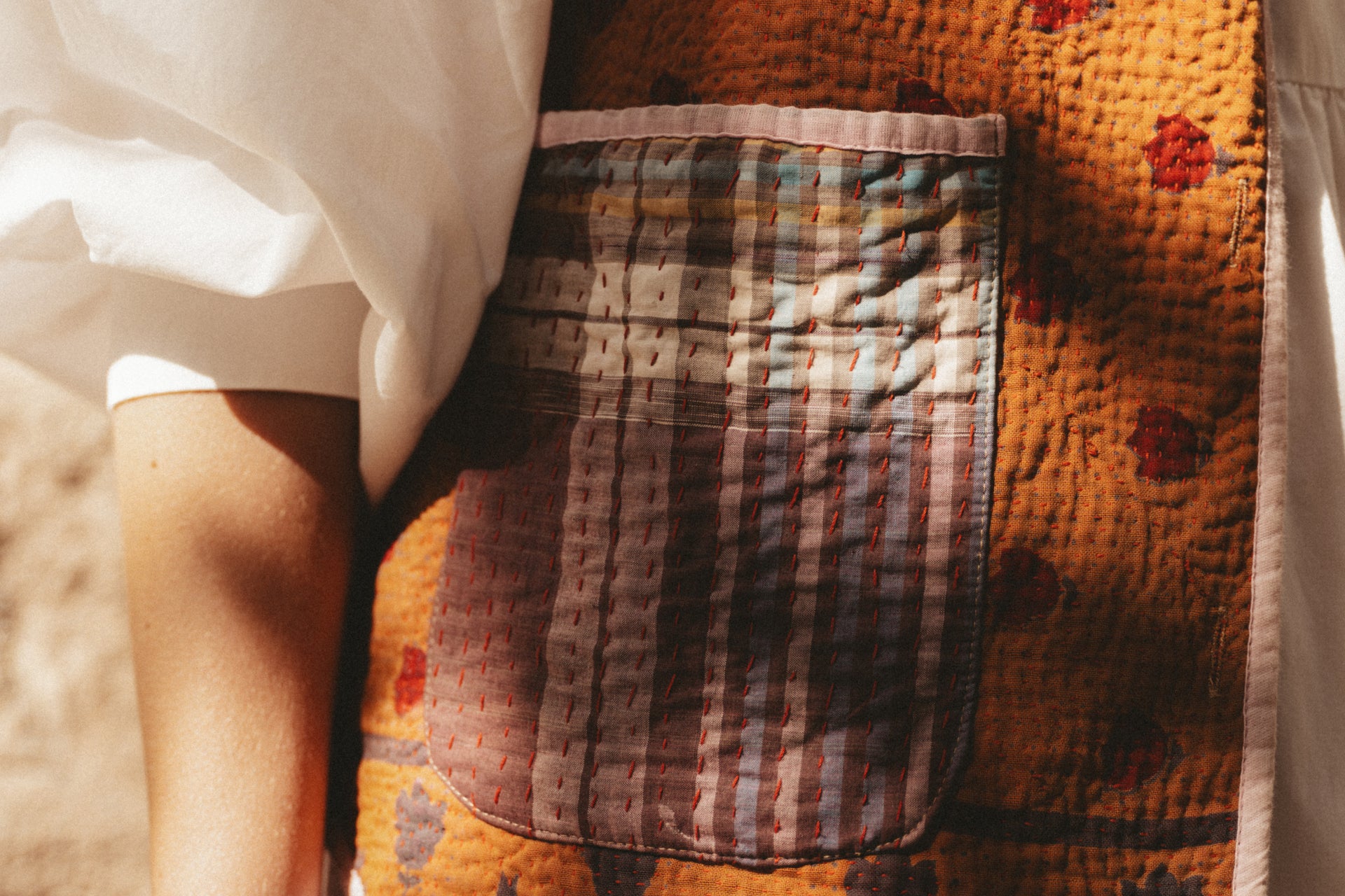 Close-up of a textured fabric with a pocket on a patterned background